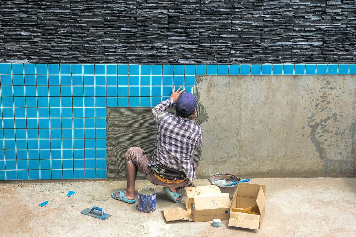 man constructing pool