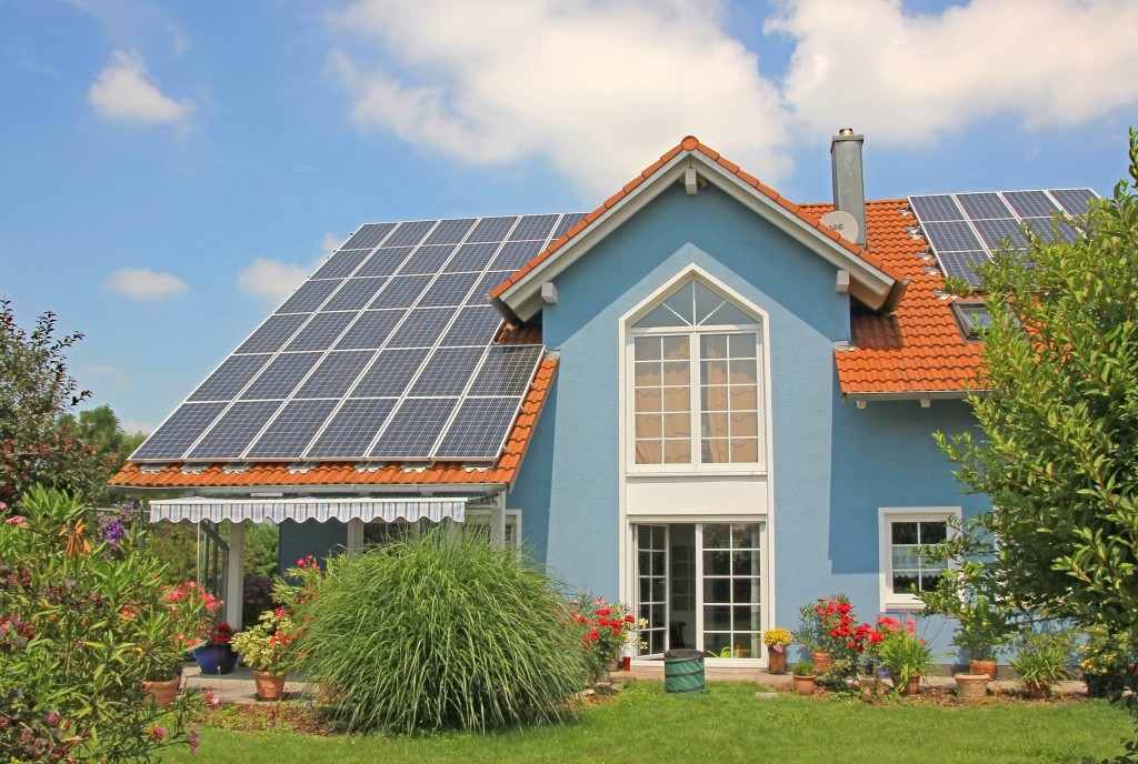 home exterior with solar panel roofing