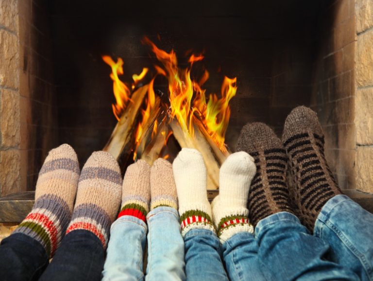 family in front of a fireplace