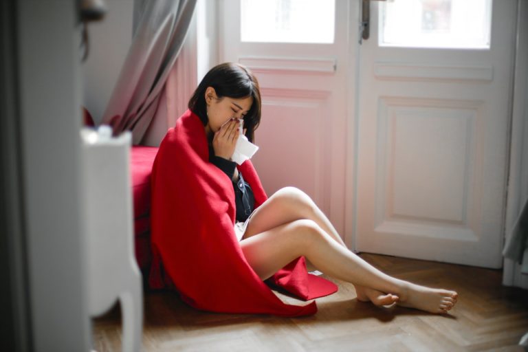 woman sick on the floor