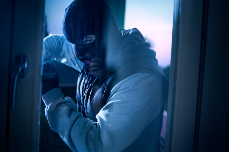 robber attempting to break in