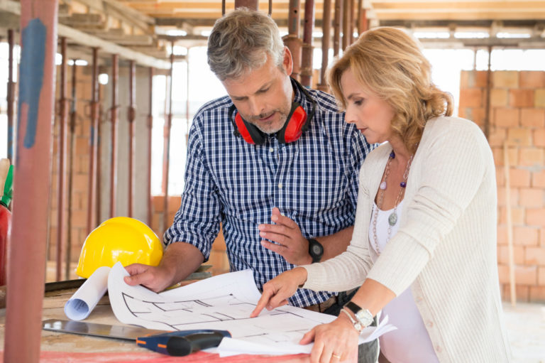 two people looking at the renovation plan