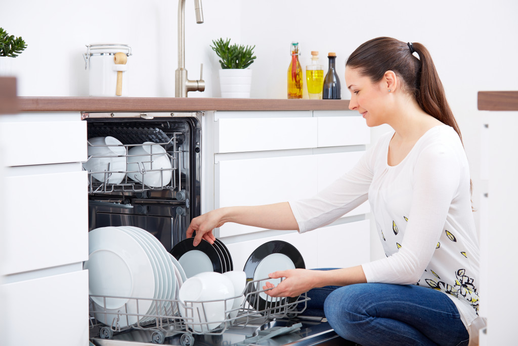 woman loading the dishwasher