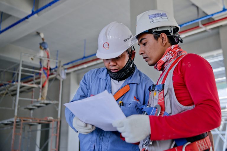 Two construction men discussing