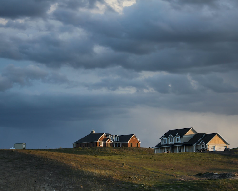 Houses Under Cloudy Sky due to coming storm